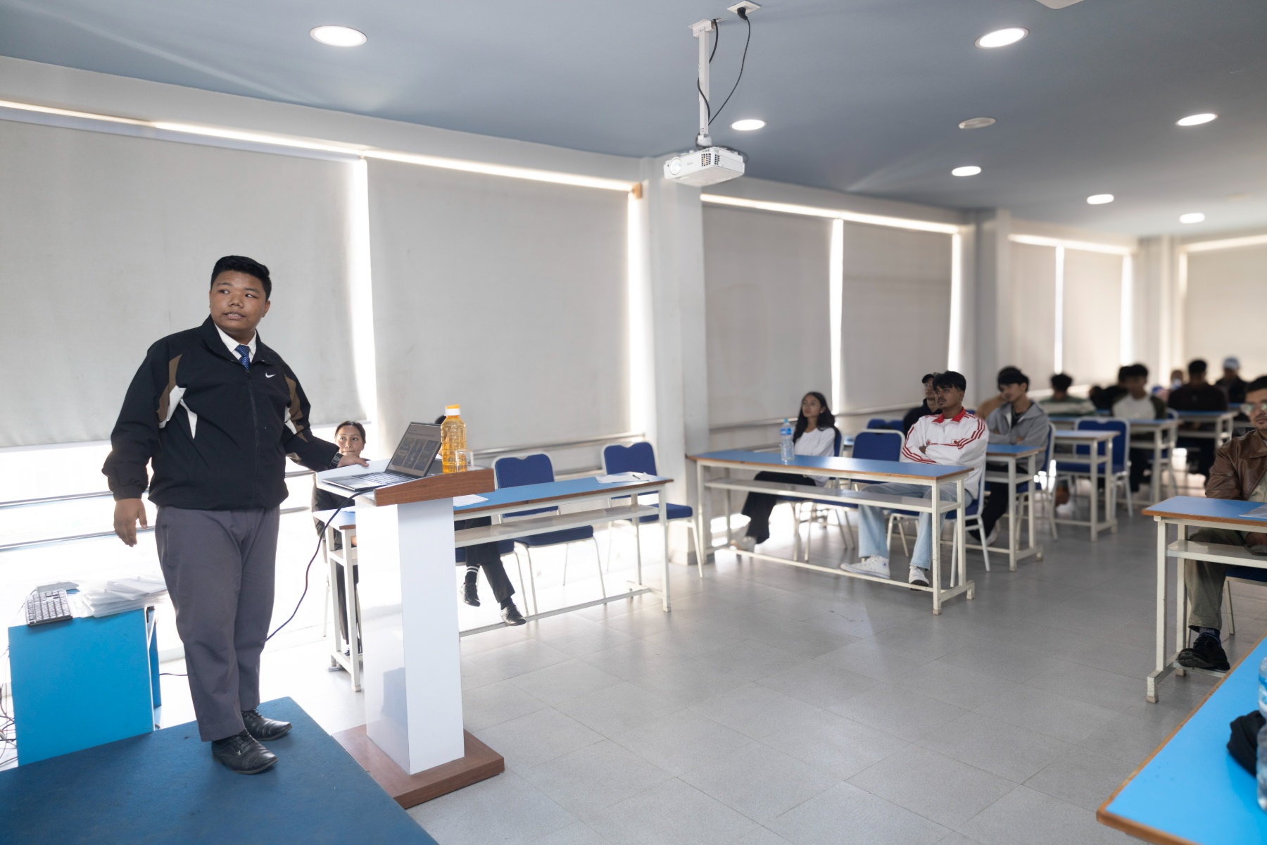 Sugam Ghale presenting SCM Tech Club to newly joined students in a classroom