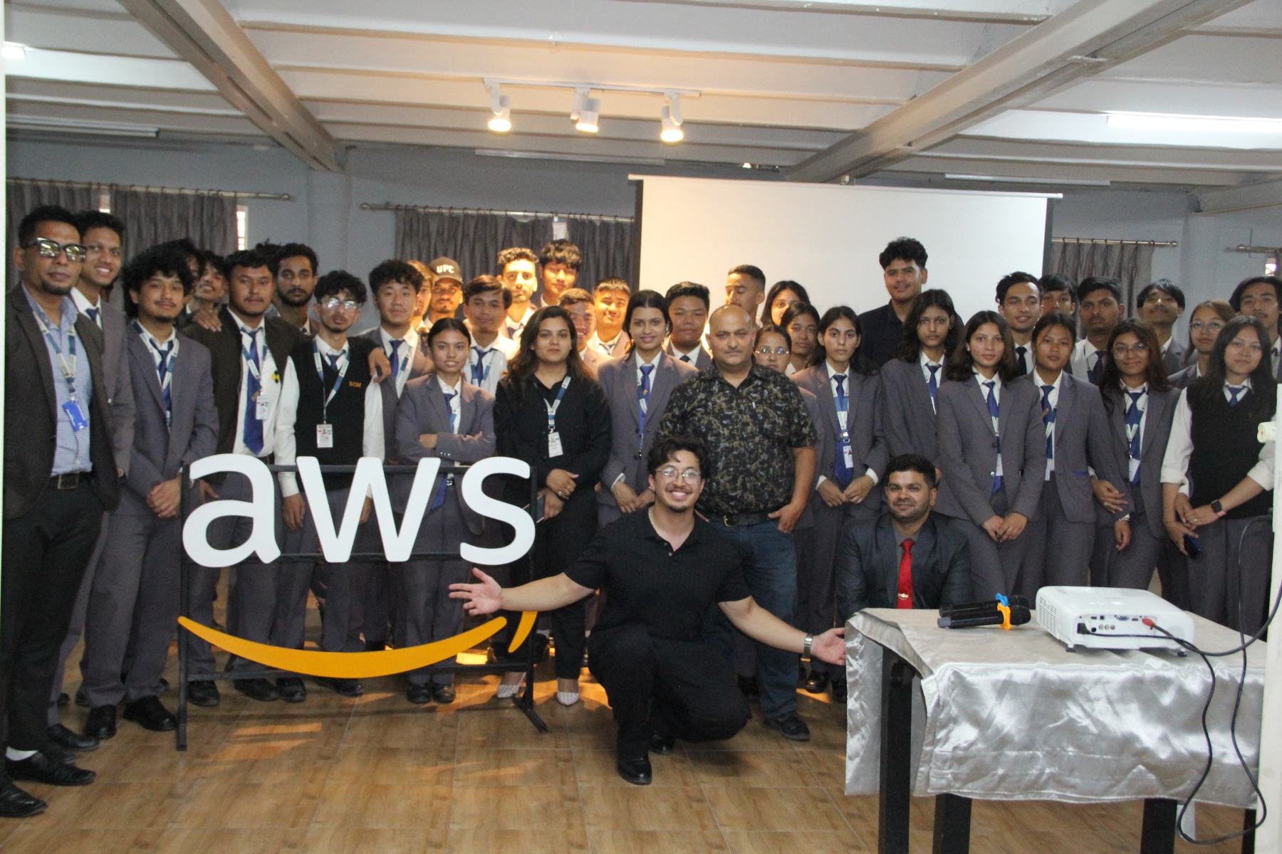 Students from Shubhashree College of Management posing for a group photo next to an AWS sign at Leapfrog Technology